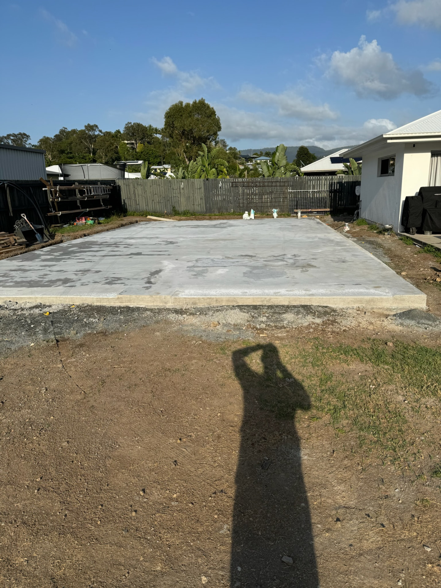 Completed shed slab poured in a backyard